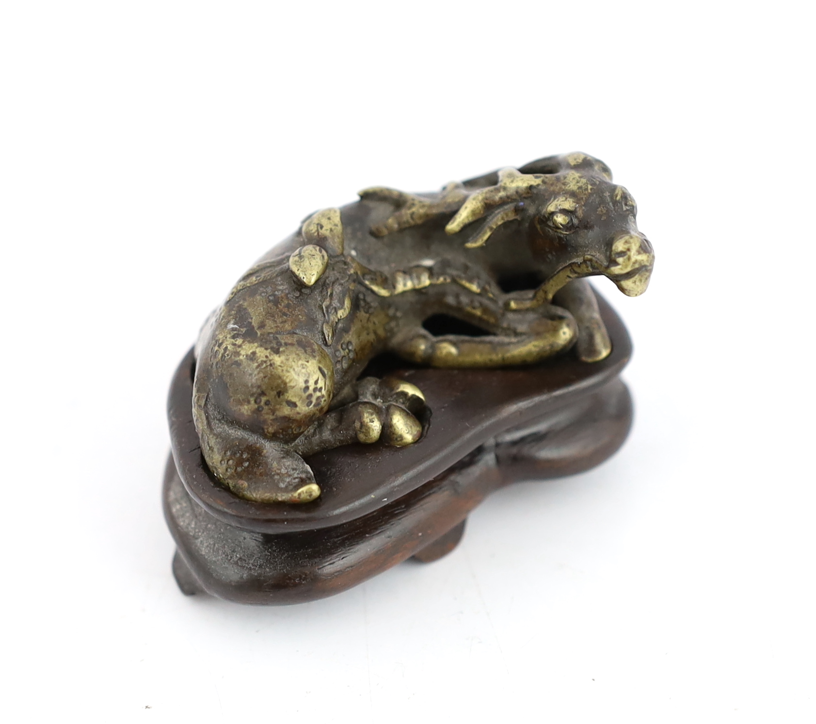 A Chinese bronze weight, in the form of a recumbent deer, late Ming/early Qing dynasty